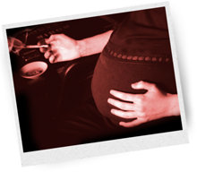 Pregnant woman smoking a cannabis joint.