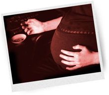 Pregnant woman smoking a cannabis joint.