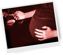 Pregnant woman smoking a cannabis joint.