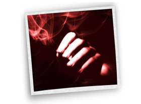 Picture of marijuana leaf and man smoking a joint.